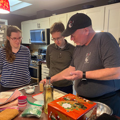 First wedding anniversary cooking class with Chef Eric and a couple in a house.
