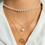 Thumbnail: ZOVOLI Dainty Pearl Flower Bow-knot Choker Necklace Long Chain Pearl Heart Gold