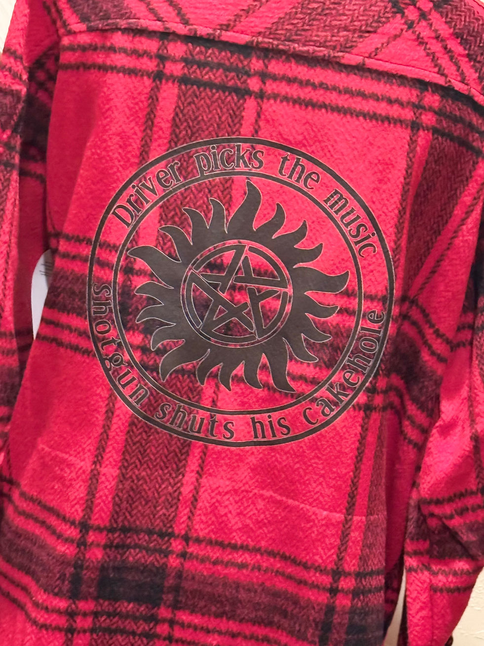 red and black shacket with supernatural tattoo