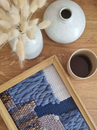 a handwoven picture in a frame