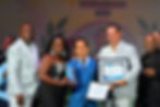 Beaches Turks and Caicos Managing Director James McAnally (2nd right) presents the Diamond Team Member of the Year to Joey Echavez (centre) while members of the Food and Beverage and Bar department share in the moment