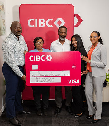 From Left: Alonzo Higgs - Corporate Manager, Parent of Salt Rakers Aquatic Club, Benneth Williams - Owner of Salt Rakers Aquatic Club, Carolaen Padua Rodriguez - Business Support Officer and Tamyra Missick - Corporate Manager