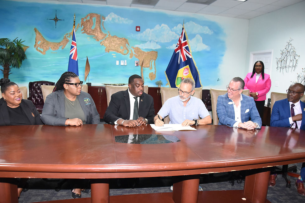 The signing of the MOU Between Government and iCARE. At third from left is Hon. Kyle Knowles – Minister of Health and Human Services; fourth from left is Steven Stern of Icare, and at fifth from left is Deryk Is Derek Meany, General Manager for Beaches Turks and Caicos Resort and Spa.