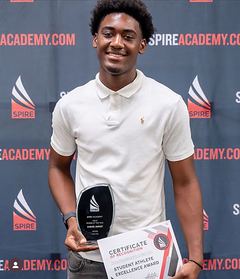 Academic and athletic excellence: Harvey accepting his Rookie of the Year award and honours certificate.