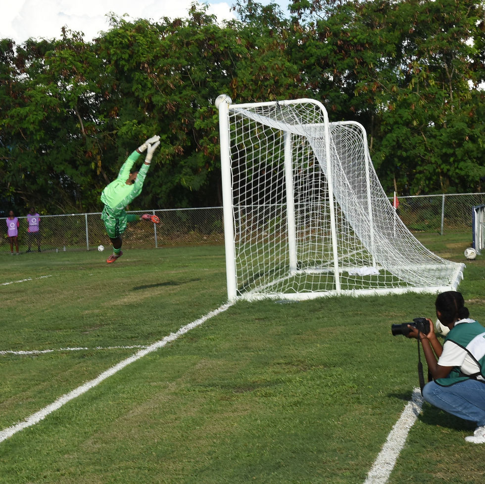 The Montserrat Goalkeeper Trent Carter Rogers is beaten by a well taken freekick from the TCI Captain Billy Forbes