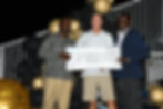 Chris Bryan (centre), of the SWA Sharks collects the second place prize from Orville Morgan (right), Public Relations Manager at Beaches Turks and Caicos Islands, and Patrick Baptiste, TCIFA League President