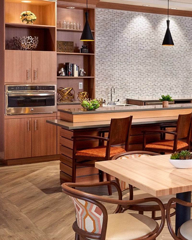 A senior living interior designed by 4 Design LLC, featuring warm, thoughtful furnishings