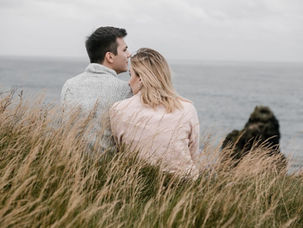 romantic-couple-spending-time-together-on-seashore-in-autumn