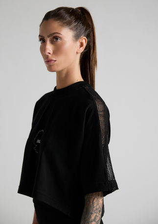 Premium women's cropped T-shirt with Ibiza-inspired embroidered logo and mesh fabric details.