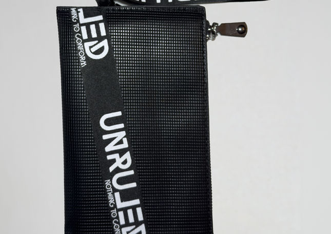 UNRULED unisex pouch crafted with premium materials and refined details.