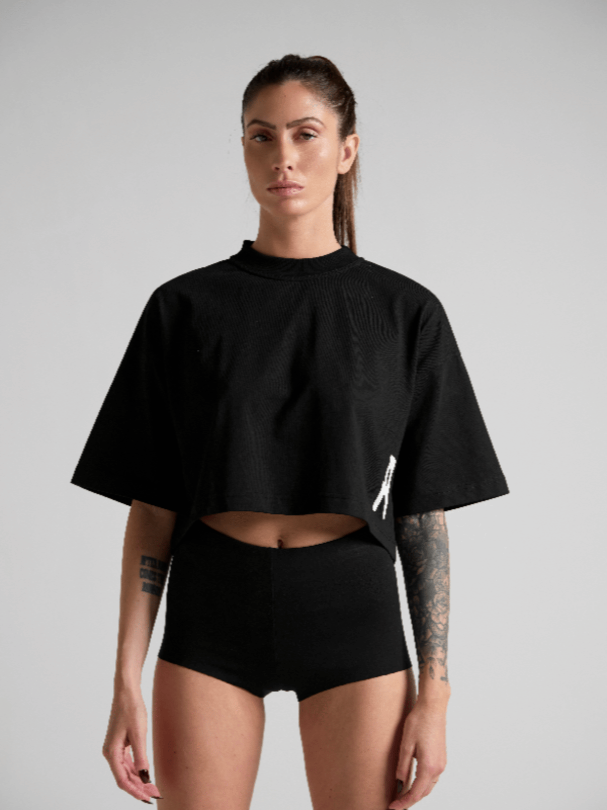 Women's black cropped T-shirt crafted from premium cotton and made in Italy.