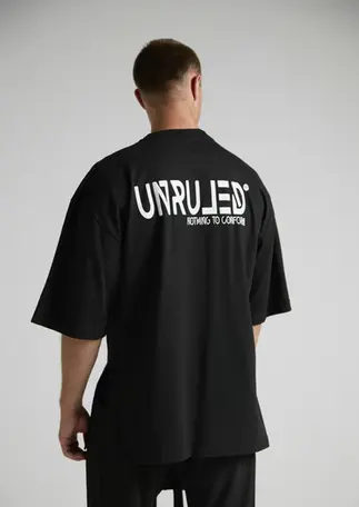 Black premium cotton T-shirt featuring an oversized architectural fit.