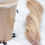 Thumbnail: side view of Dolled Up Hair & Beauty Co. nano bead hair extensions in a loose braid in the colour vanilla latte