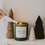Thumbnail: Christmas Cookies 15oz Soy Candle shown on a table next to xmas tree decor