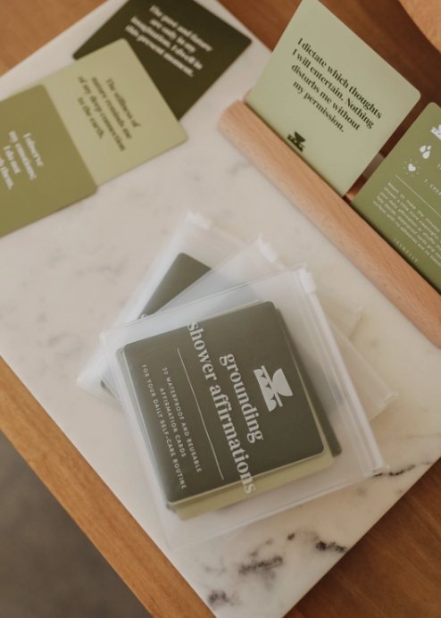 Grounding Shower Affirmation™ Cards for Adults shown on a table