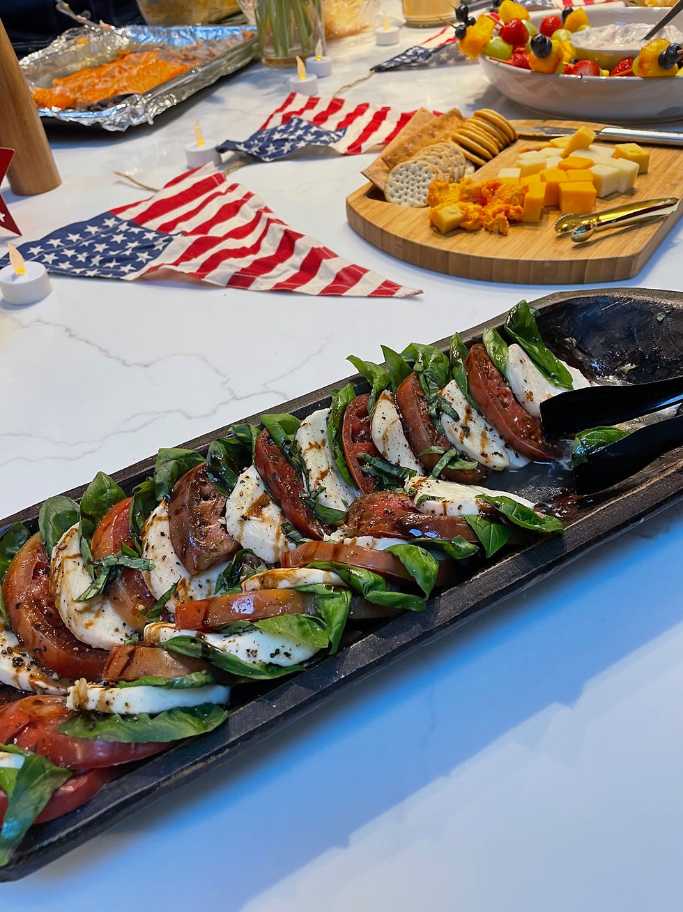 Thumbnail: large dough bowl on a kitchen counter next to other food and American flag decorations