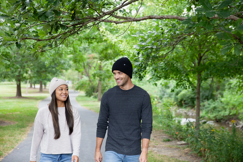Woman and Man wearing the beige and black Adult Ribbed Knit Cuff Beanie Hats