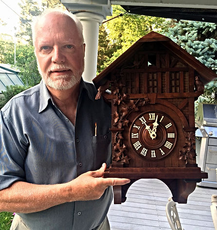 black forest clock, black forest clocks, cuckoo clock, trumpeter clock, flute clock, monk clock. organ clock