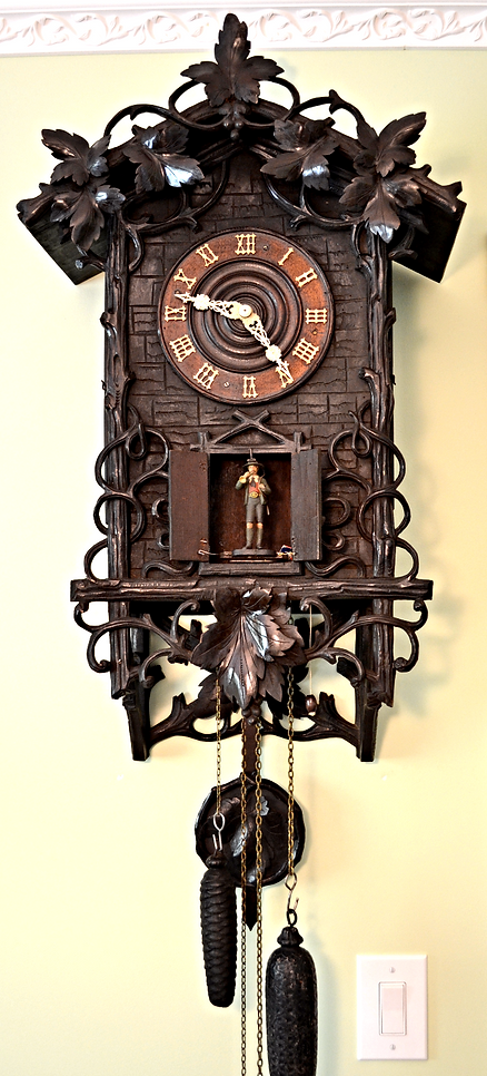 black forest clock, black forest clocks, cuckoo clock, trumpeter clock, flute clock, monk clock. organ clock