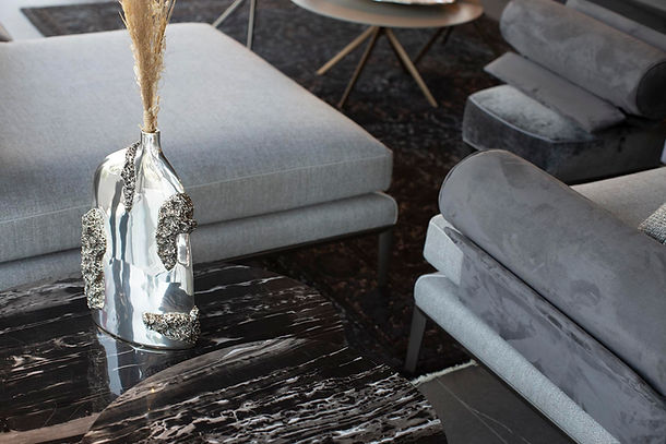 A silver Flower Vase on a Marble Table