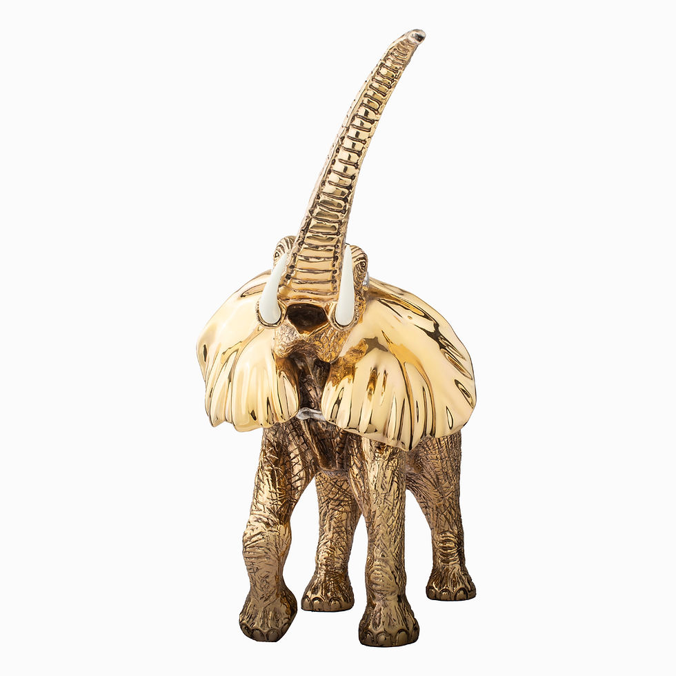 Gold elephant figurine, trunk raised