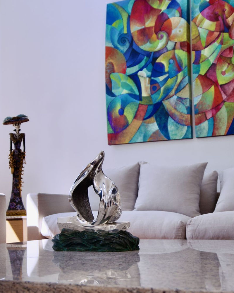 Silver bird sculpture on a coffee table