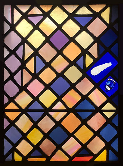 The transom, showing Halley's comet and the robotic spacecraft Giotto. Detail from Window 23: The Prodigal Son in the church of Saints Leonard and Fergus, Dundee, Scotland. Designed and made by AJ Naylor.