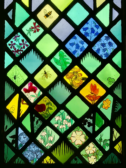 More flowers at the bottom of Window 10: Saint Margaret of Scotland in the church of Saints Leonard and Fergus, Dundee, Scotland. Designed and made by AJ Naylor.