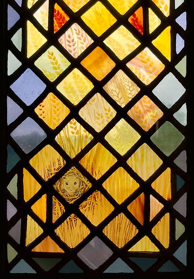 Rabbie Burns' 'wee tim'rous' beastie' snuggled into a cosy nest in a field of wheat. Detail from Window 14: The Eucharistic Bread in the church of Saints Leonard and Fergus, Dundee, Scotland. Designed and made by AJ Naylor.