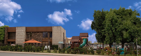 Picture of brown building with playground