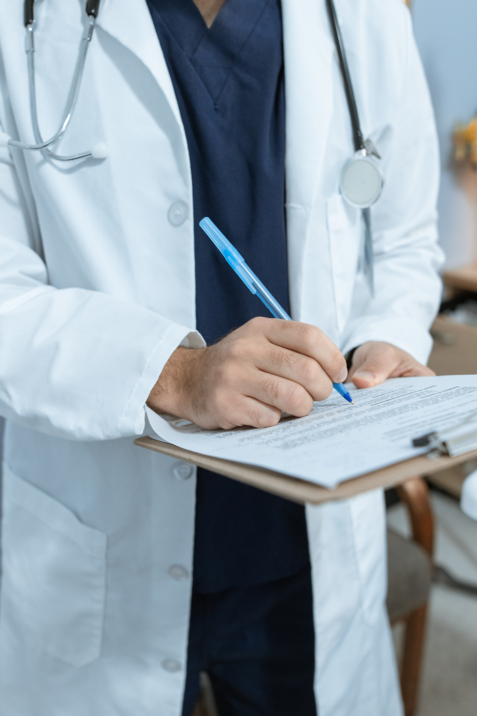 doctor providing exam to patient and writing notes.png