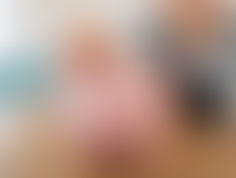 Child placing coin into piggy bank, learning saving habits and money basics