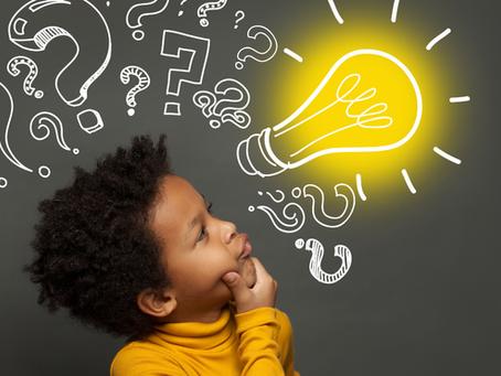 Young child thinking creatively with illustrated question marks and a glowing lightbulb drawn above their head, symbolizing curiosity and problem-solving in learning.