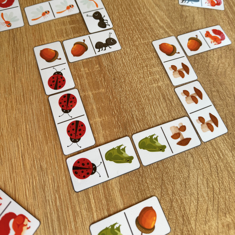 Thumbnail: Forest Domino cards spread out on a wooden surface, showcasing the engaging nature-themed game pieces.