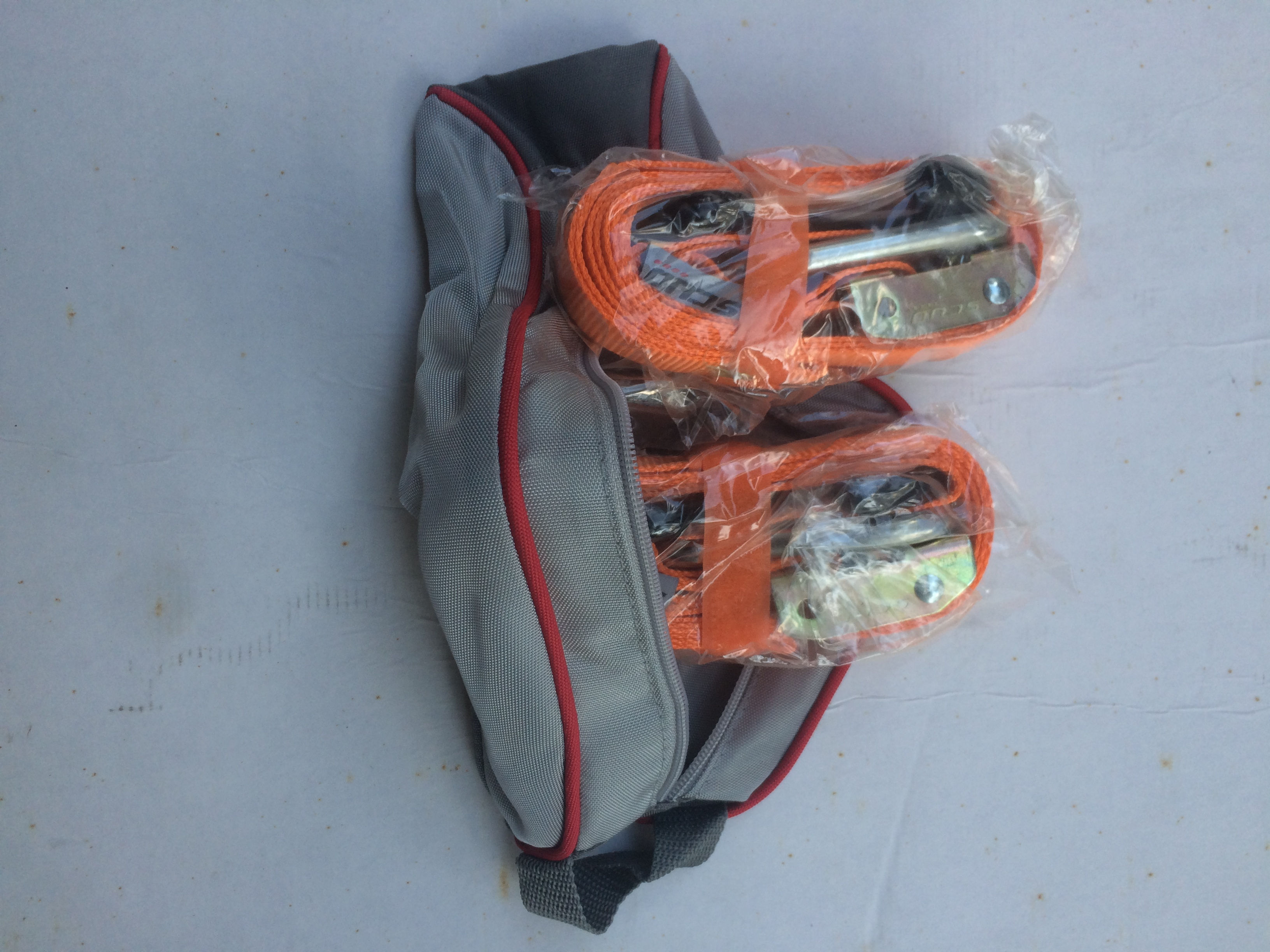 Esticadores (tie-downs) com bolsa.