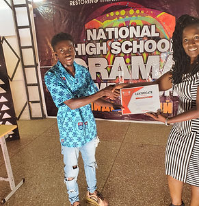 Giving a certificate to the winning school in Ghana