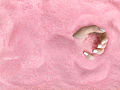 Hand in Pink Sand