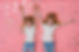Twin girls celebrate birthday. Smiling, positive curly blonde sisters 6 years old, dressed