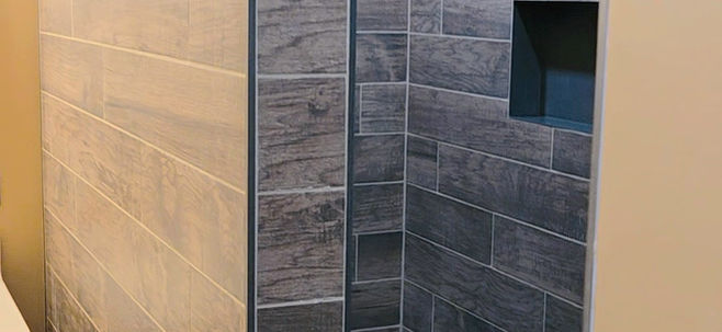 Finished shower remodel in Millcreek, Erie County, PA with a custom wall niche and custom tiled bench by CBC Remodeling & Services