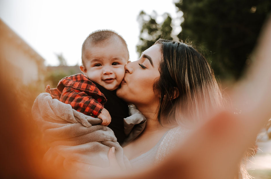 woman kiss a baby while taking picture_edited.jpg
