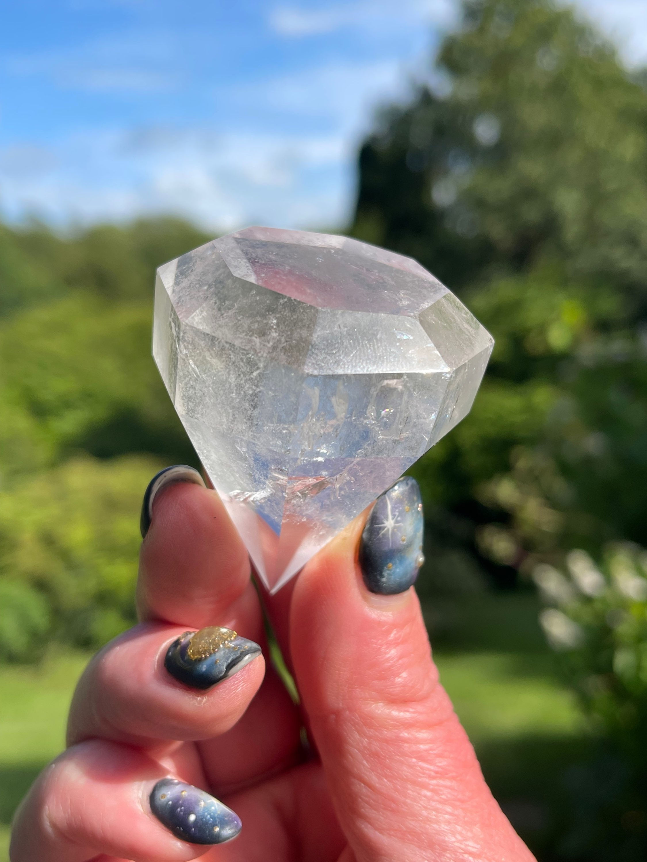 Faceted Clear Quartz Diamond Cut Gemstone in Stand