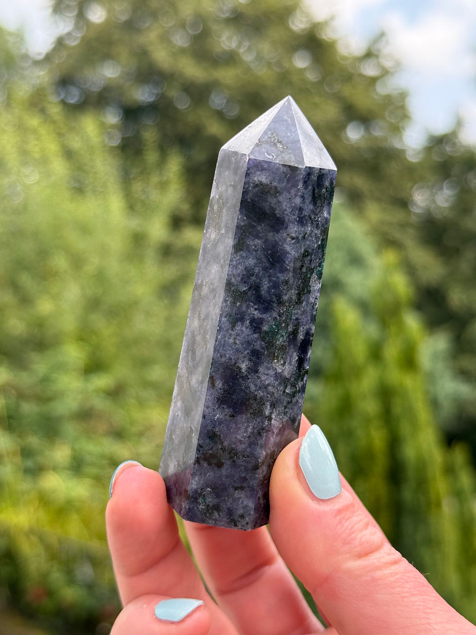 Iolite Point with Blue Apatite Inclusions Leans a Little