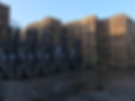 Fork trucks in front of pallets
