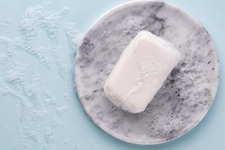 Premium Photo _ Soap bar and foam on white background, top view_ mockup for design.jpeg