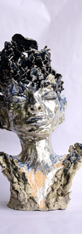 Sculpture of a king in the colours of charcoal and silver. Very regal looking, a unique piece for any home decor.
