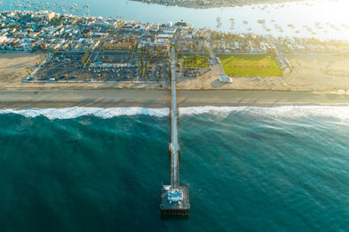 Aerial drone photo above Balboa Pier in Newport Beach, Orange County.