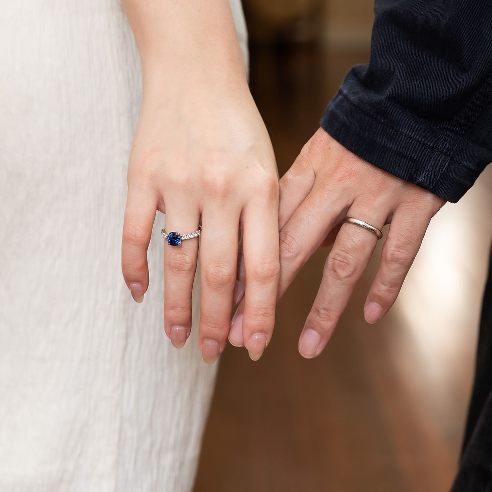 a couple wearing their wedding rings