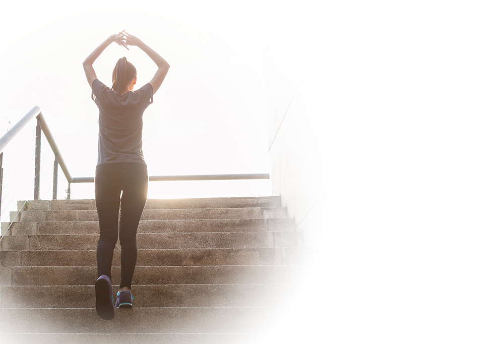 rear-view-sporty-woman-stairs.png