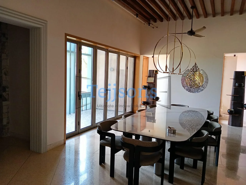 Interior slide and fold doors connecting dining space to balcony