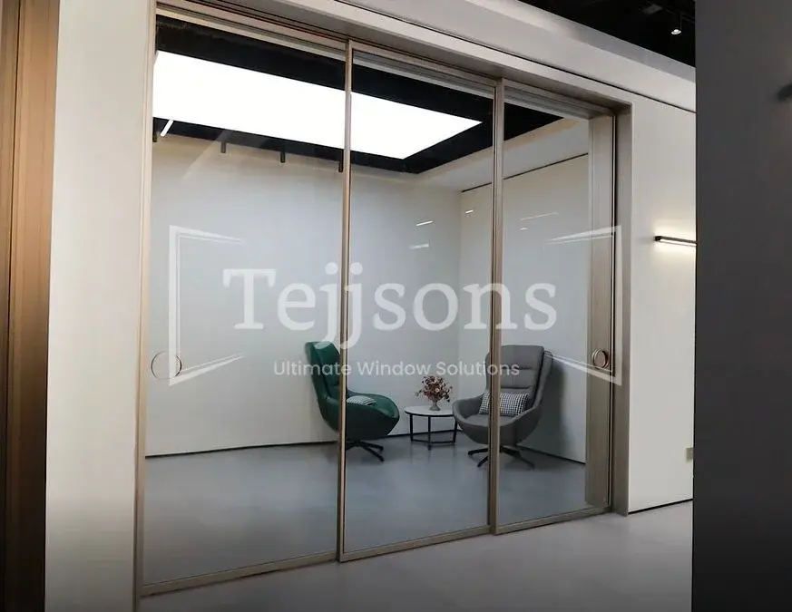 Sleek aluminium sliding doors dividing interior living spaces